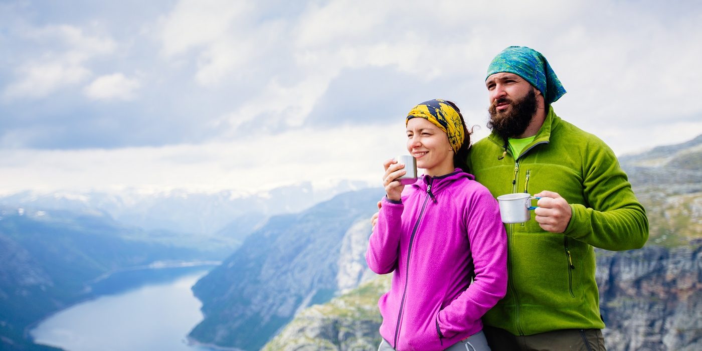 Couple hiking and drinking water