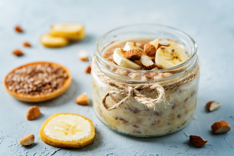 Overnight oatmeal with banana slices and almonds