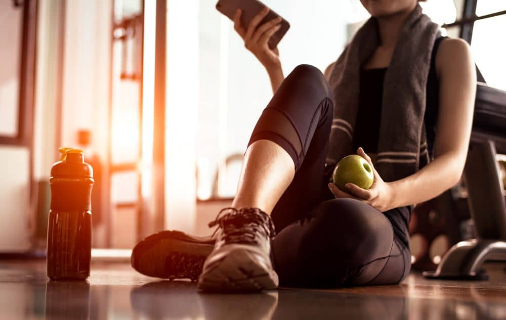 Eating an apple after workout.