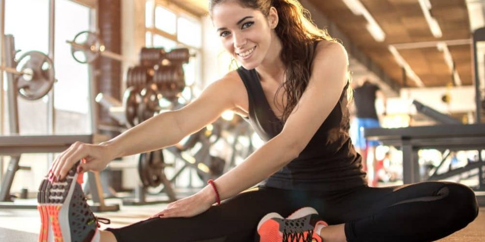 Sporty woman stretching.