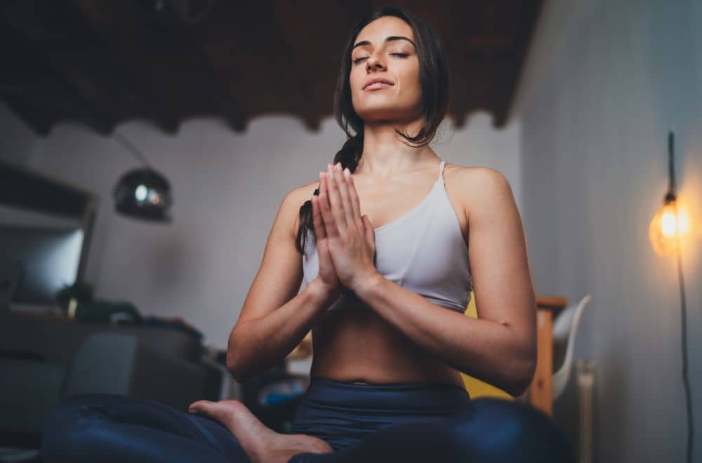 Young woman practicing meditation.