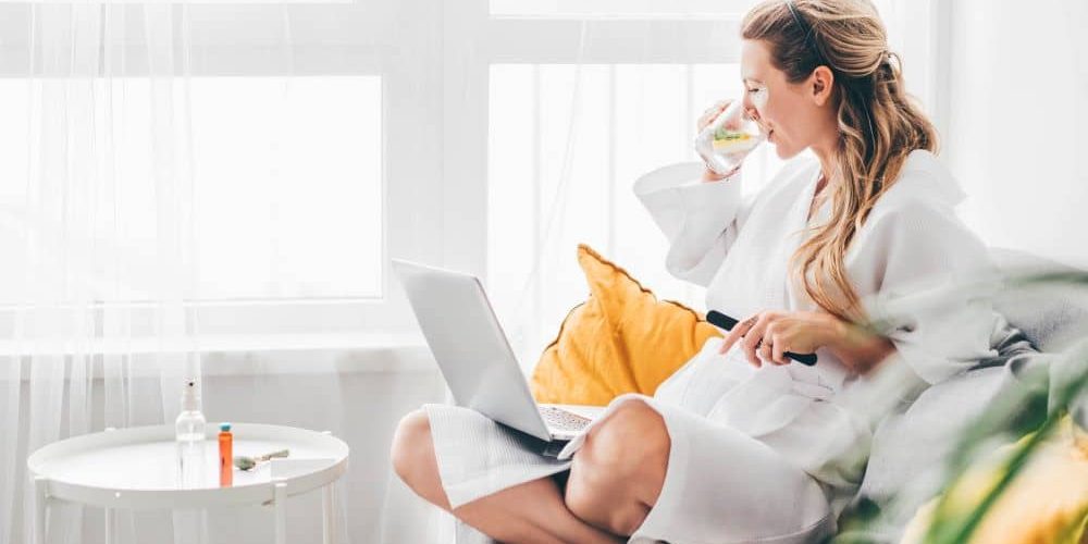 Woman drinking lemon water.