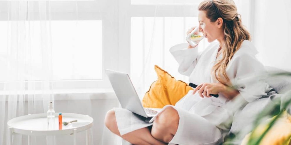 Woman drinking lemon water.