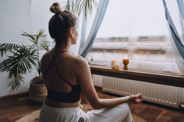 Woman meditating at home.