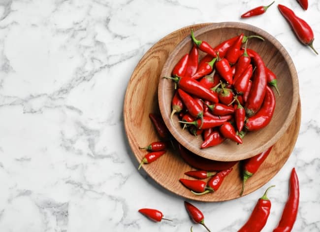 Hot and spicy chili peppers appear to increase metabolic rate, increasing calorie burn and fat metabolism.